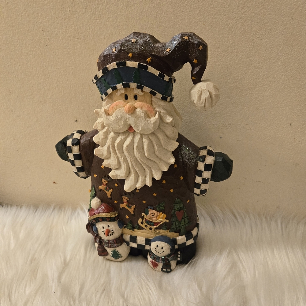 Santa Claus Figurine with Snowmen and Reindeers.